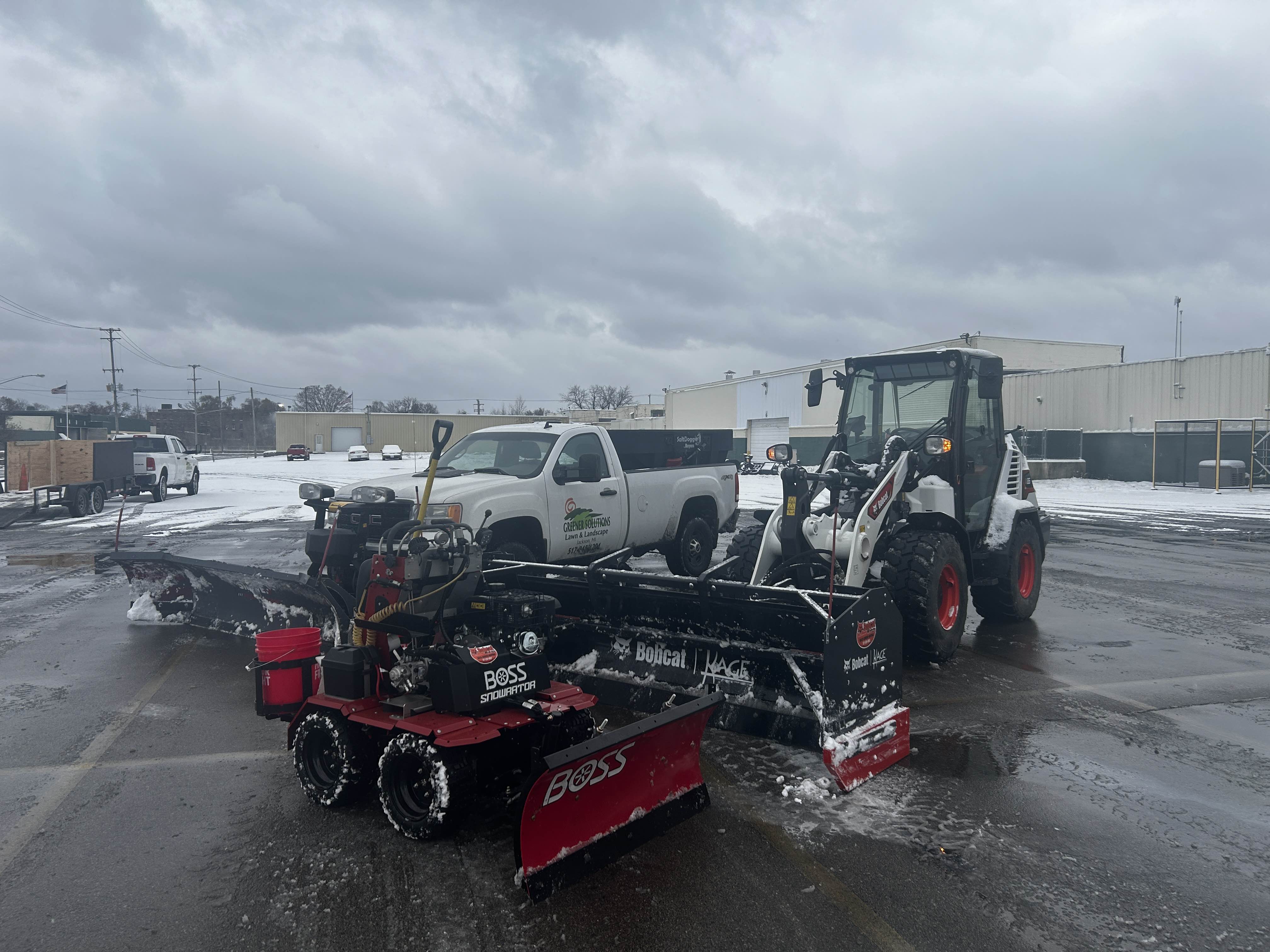 Commercial snow removal equipment including Bobcat and Boss plow
