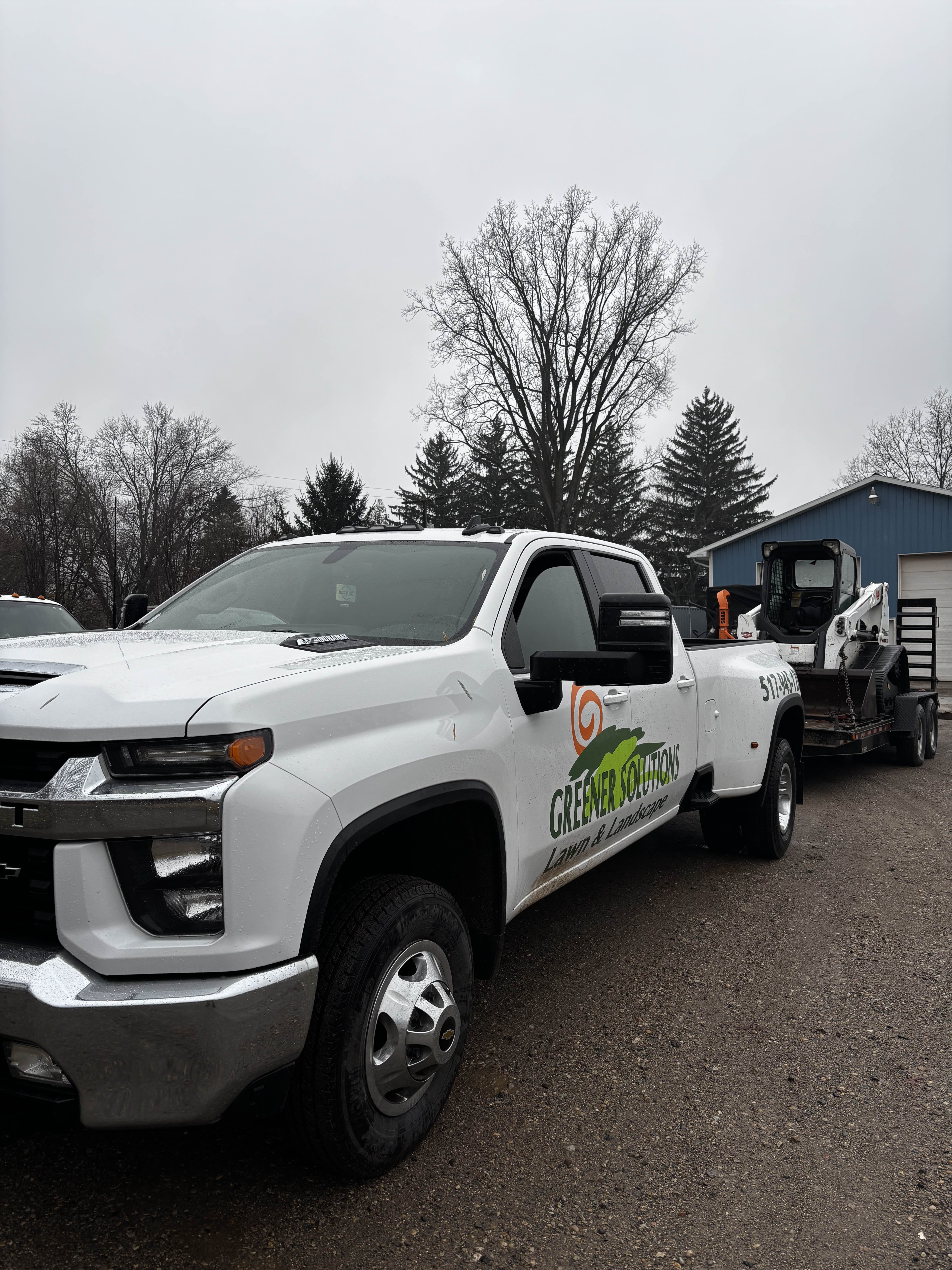 Truck and trailer with Bobcat equipment